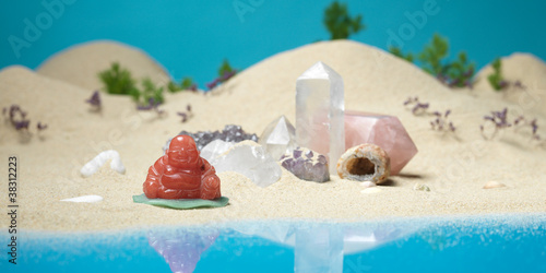 quartz crystals laughing buddha in miniature landscape