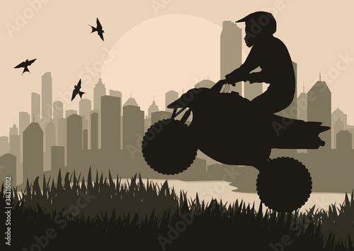 All terrain vehicle motorbike rider in skyscraper city
