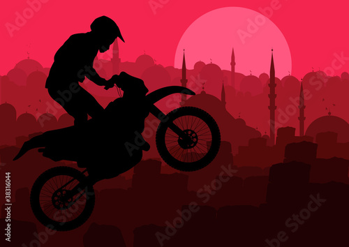 Motorbike rider in Arabic city landscape background