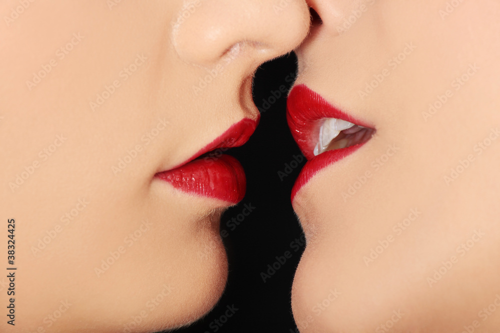 Closeup of pair women mouths kissing Closeup of pair women mouths kissing