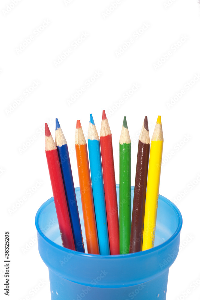 Color pencils spread out in cup.