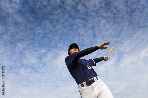 young baseball player taking a swing photo