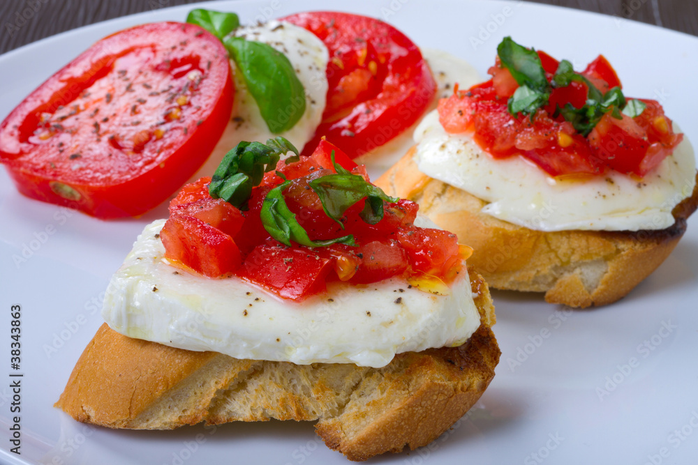Tasty bruschetta on white plate Tasty bruschetta on white plate