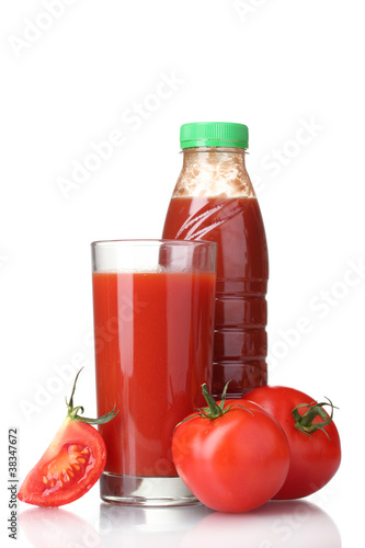 Tomato juice in glass, bottle and tomato isolated on white
