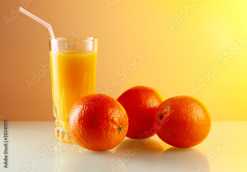 oranges and glass with juice.