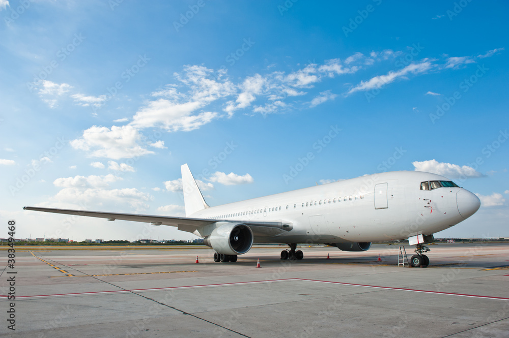 Commercial airplane parking at the airport Commercial airplane parking at the airport