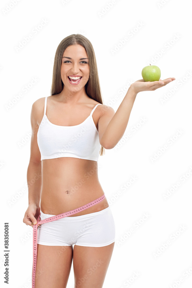 slim and fit woman with measuring tape and apple slim and fit woman with measuring tape and apple
