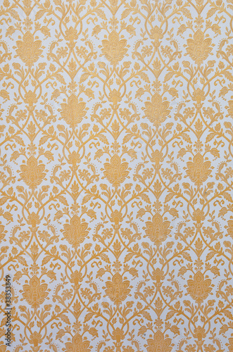 flower pattern in traditional Thai style art on wall of the temp
