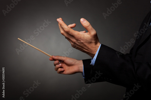male music conductor directing