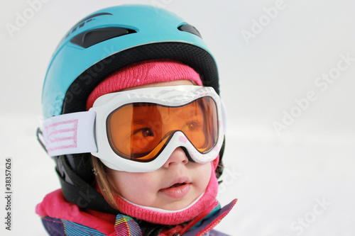 Little girl with ski helmet