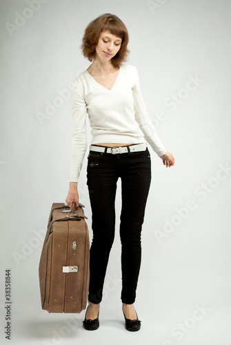 Young woman holding a trunk