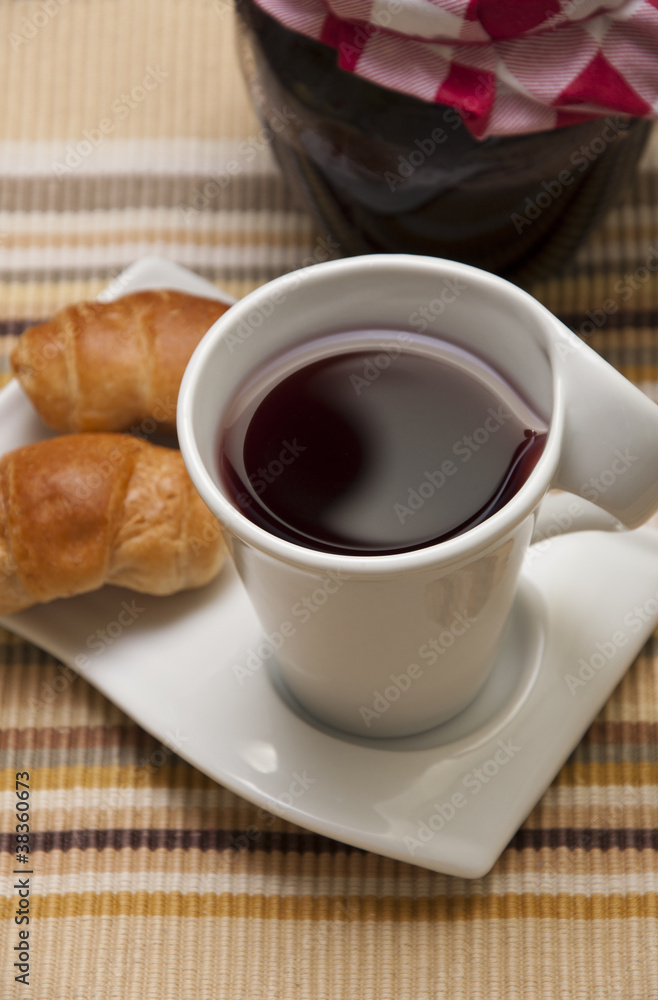 Tea, mini croissants and jam jar Tea, mini croissants and jam jar