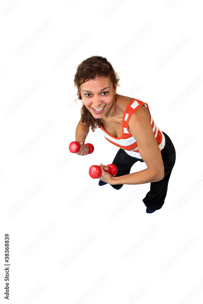 Woman using dumbbells Woman using dumbbells