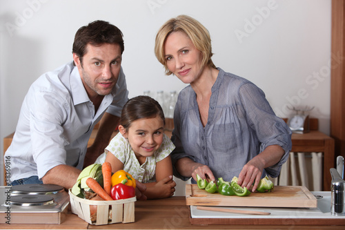 Family in kitchen cooking together