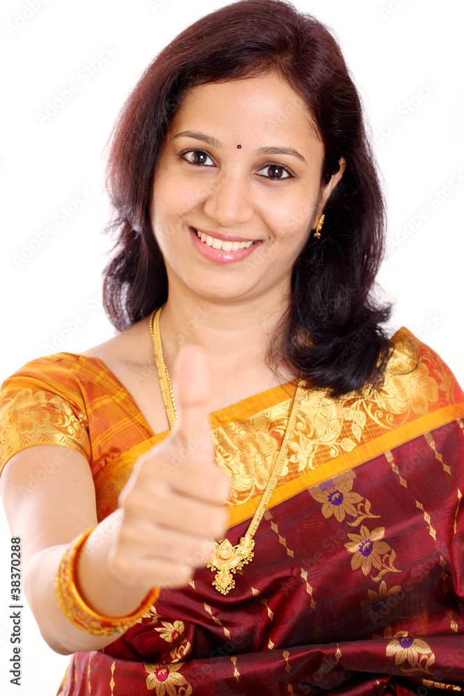 Traditional young Indian woman showing thumbs up Traditional young Indian woman showing thumbs up