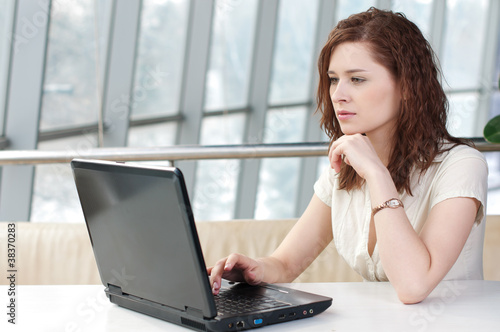 Young business woman with laptop