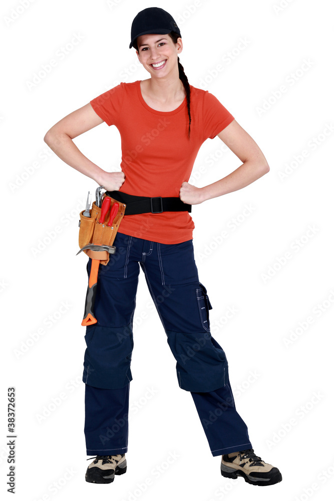 Full-length portrait of a smiling tradeswoman Full-length portrait of a smiling tradeswoman