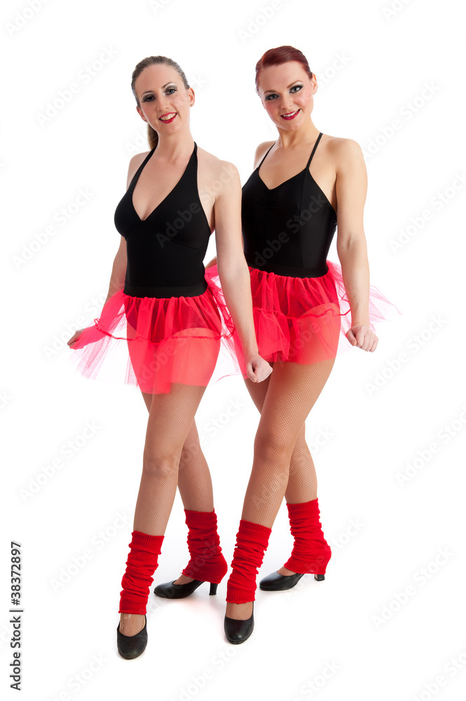 Two pretty female dancers isolated against white Two pretty female dancers isolated against white