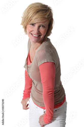 Studio portrait of a smiling blonde woman in her thirties