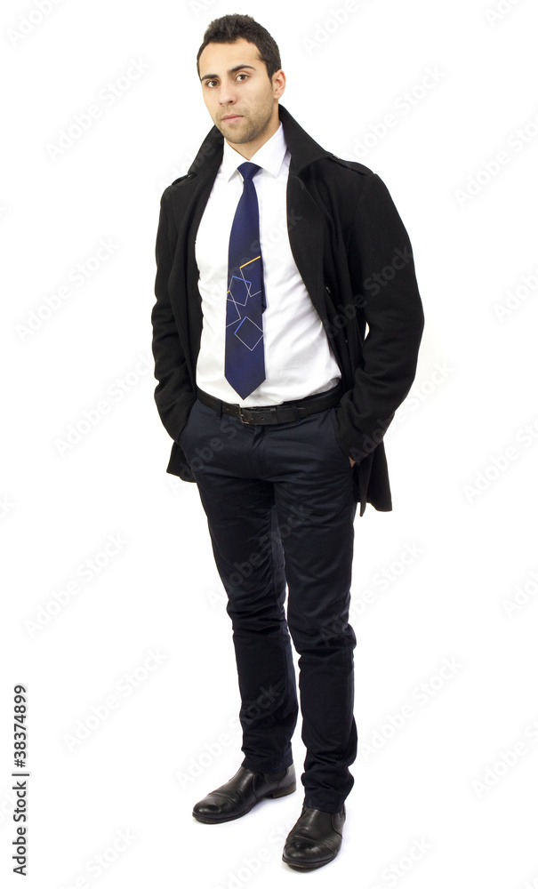 Portrait of a serious young businessman with hands in pockets Portrait of a serious young businessman with hands in pockets