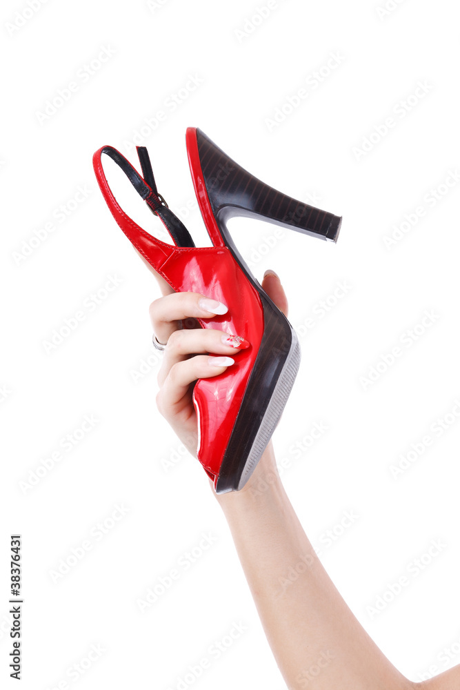 female holding red shoe female holding red shoe