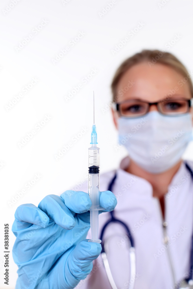Young female doctor with syringe Young female doctor with syringe