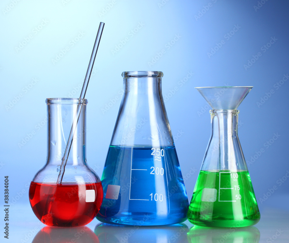 Three flasks with color liquid with reflection Three flasks with color liquid with reflection