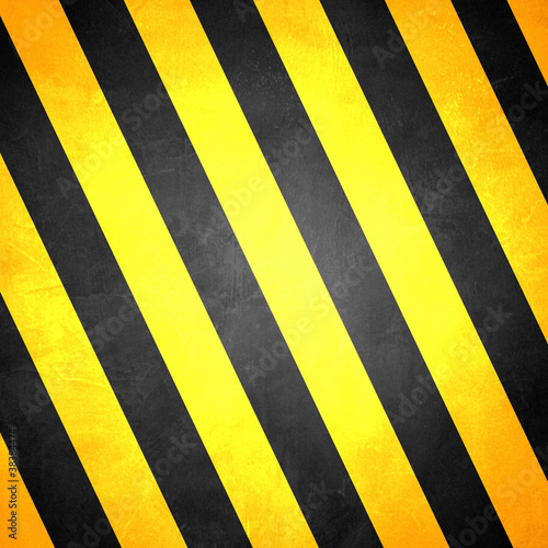 A grungy and worn hazard stripes texture