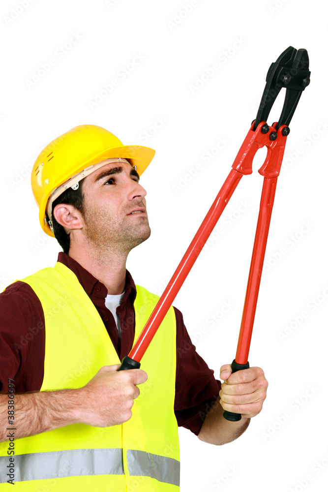 Manual worker with bolt cutter Manual worker with bolt cutter