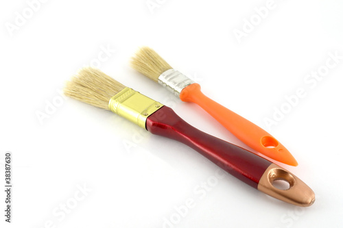 Paint brush with brown and orange handles