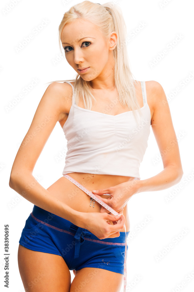 beautiful blonde is measuring her waist beautiful blonde is measuring her waist