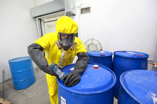 Professional in uniform dealing with chemicals
