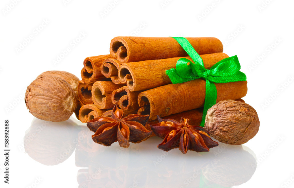 Cinnamon sticks, nutmeg and anise isolated on white