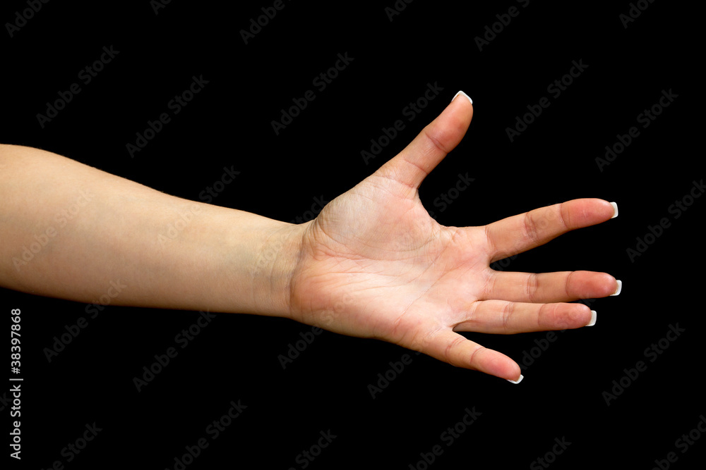 Female hand with open palm over black background Female hand with open palm over black background