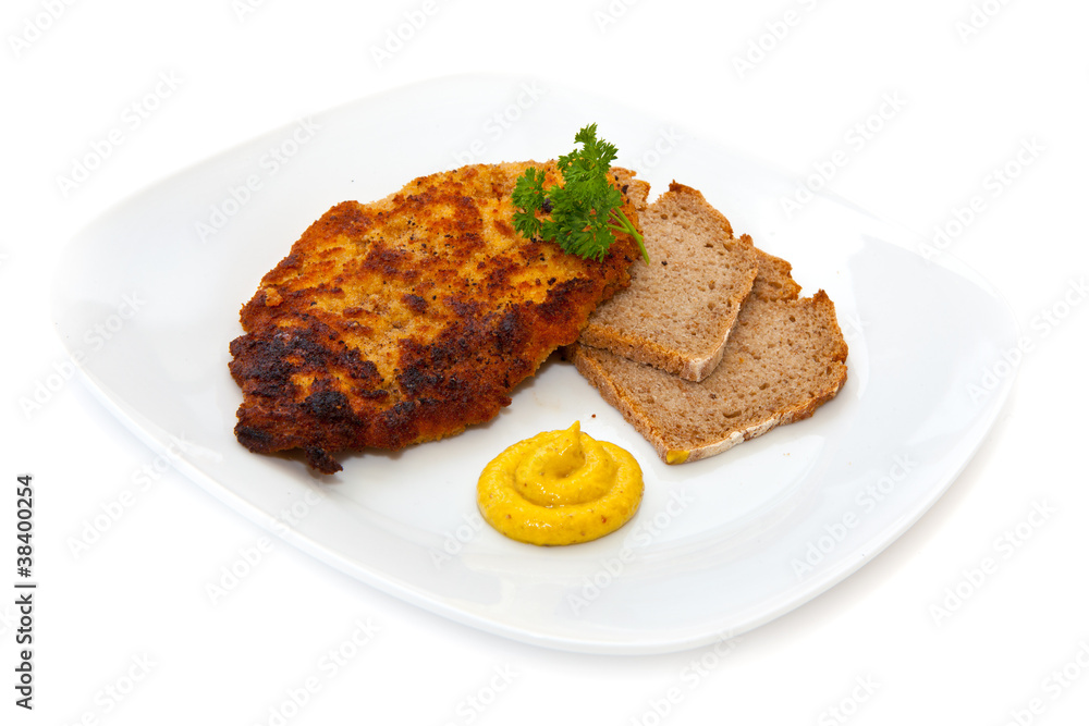 Schnitzel mit Brot, Senf und Petersilie