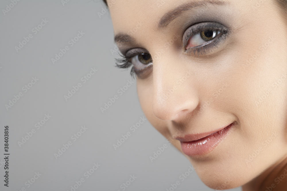 Naklejka premium Portrait of young woman in beauty style pose