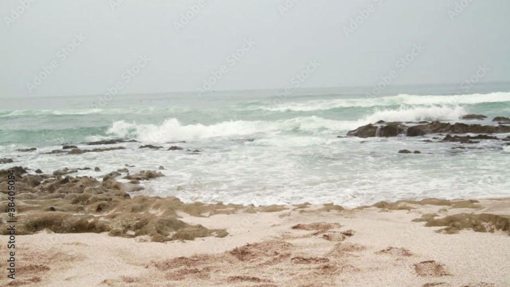 Excited businessman running to the sea, slow motion Excited businessman running to the sea, slow motion