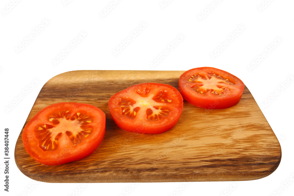 Cutting board with tomato slices Cutting board with tomato slices