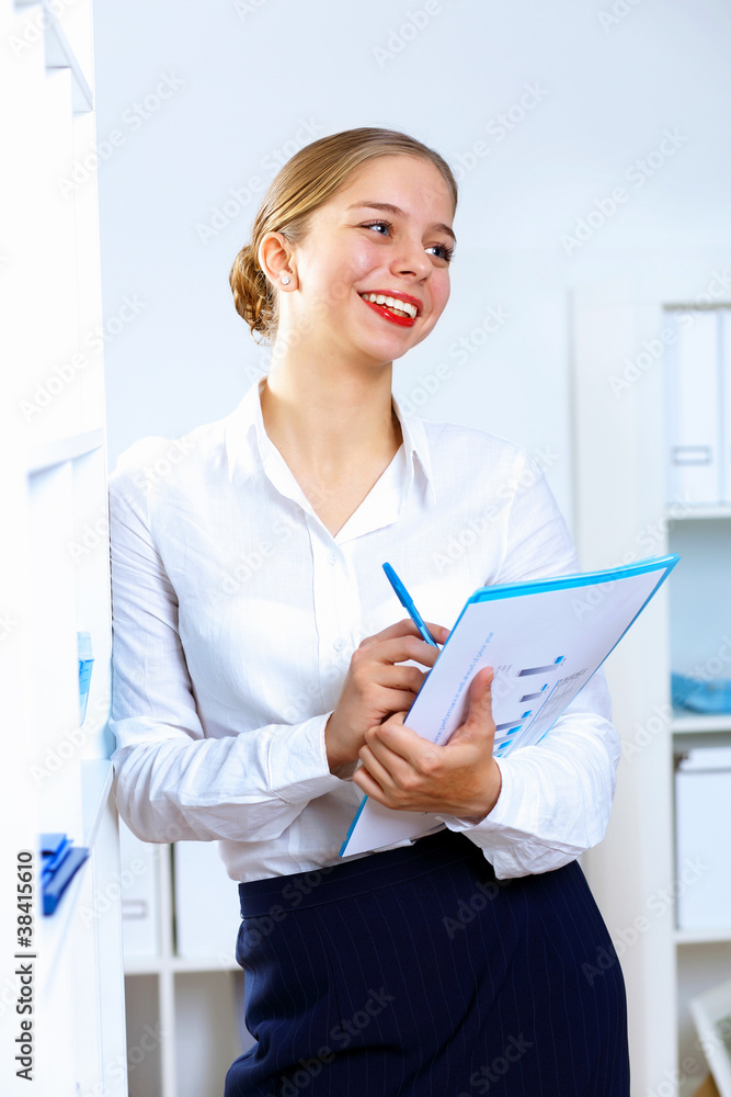 Young woman in business wear working in office Young woman in business wear working in office