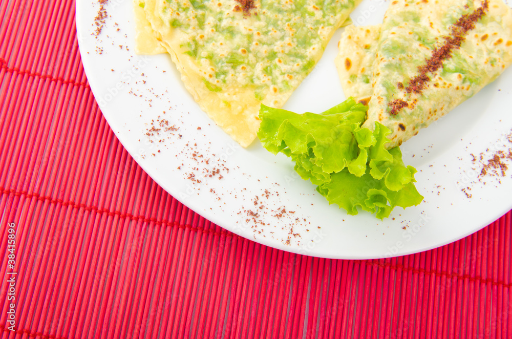 Pancake with herbs in the plate Pancake with herbs in the plate