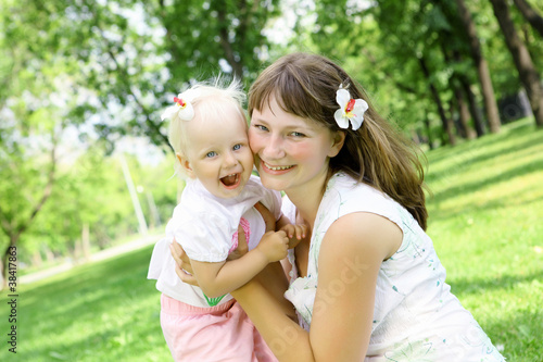 Mother with her daughter outdoors