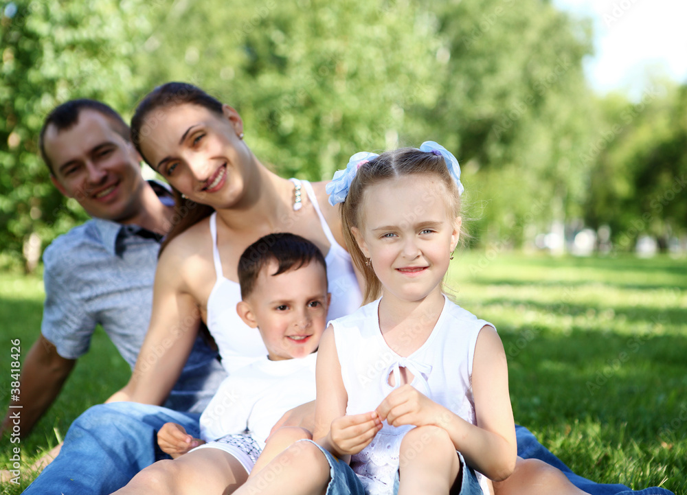 Family with two children in the summer park Family with two children in the summer park
