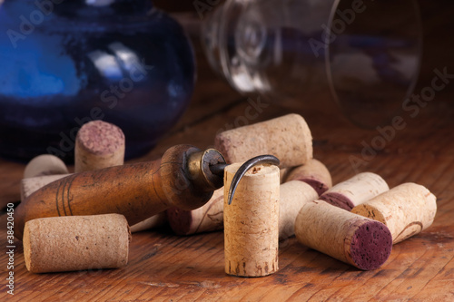 Old corkscrew and corks