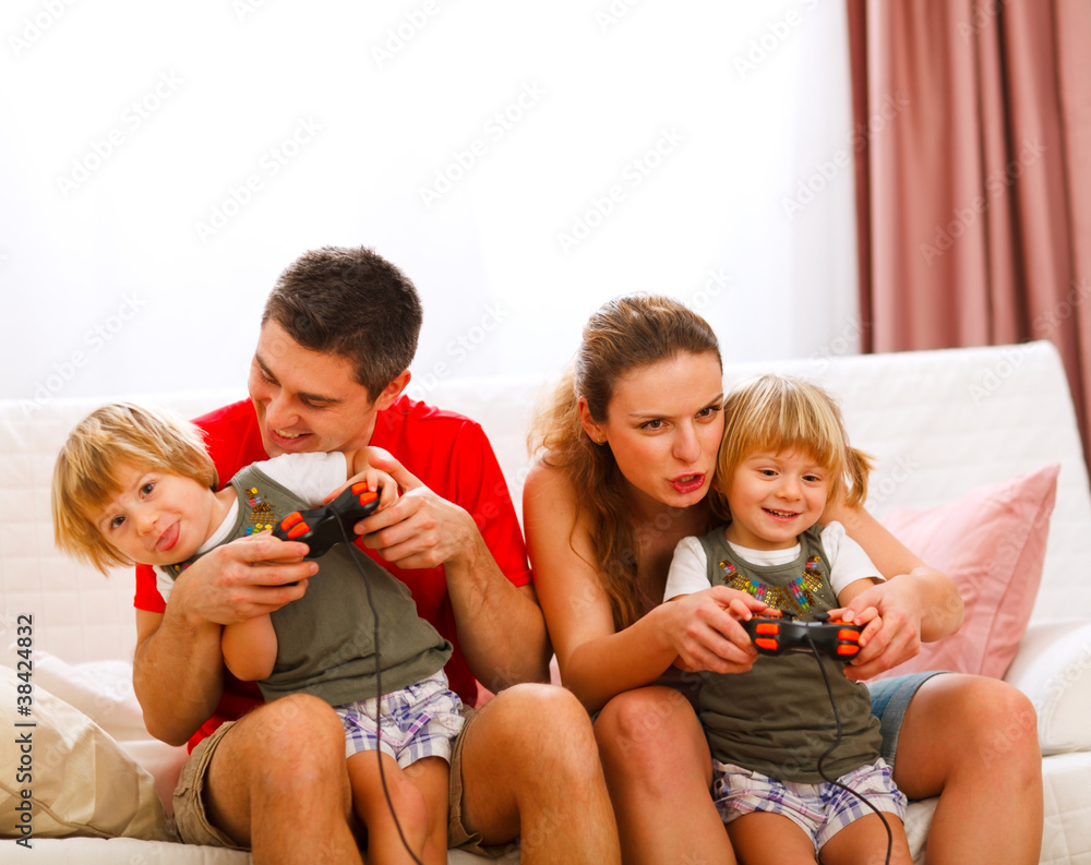 Family spending time together and playing on console at home Family spending time together and playing on console at home