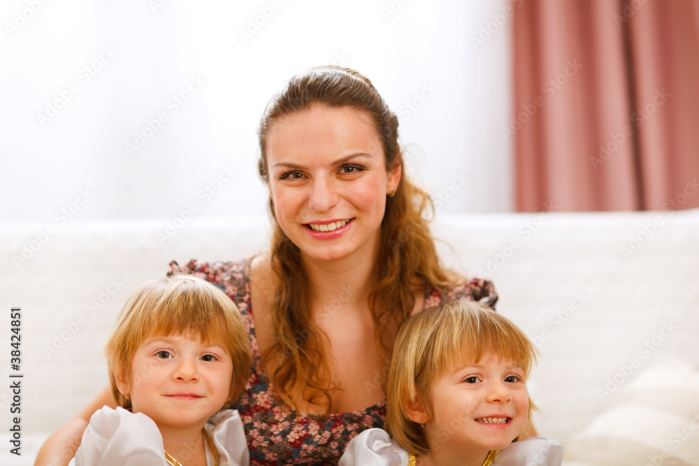 Portrait of mother with twins daughters Portrait of mother with twins daughters