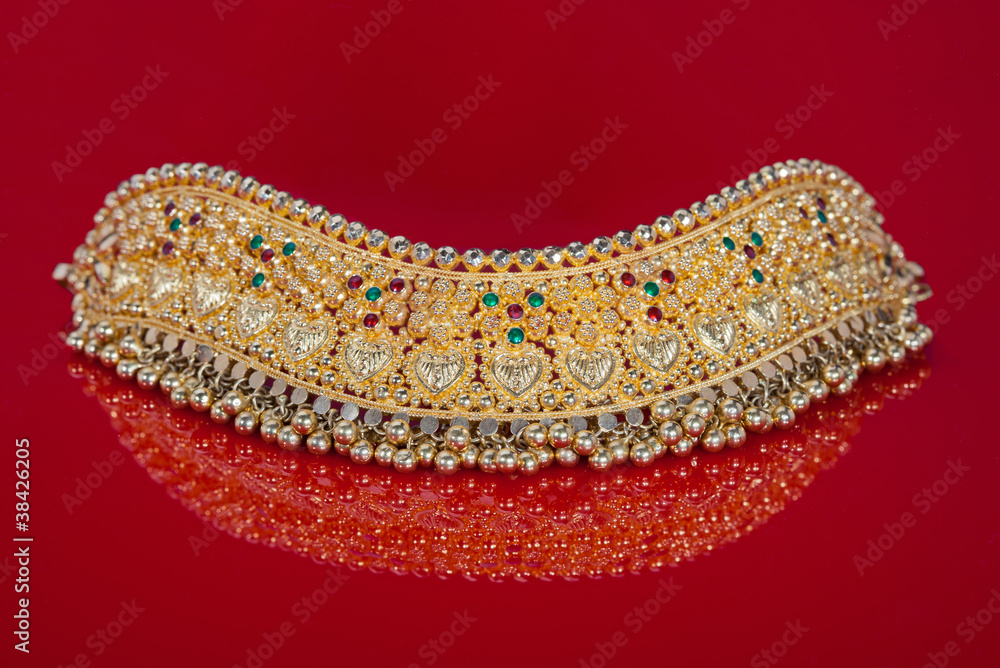 Beautiful Gold Choker Necklace on a Deep Red Background Beautiful Gold Choker Necklace on a Deep Red Background