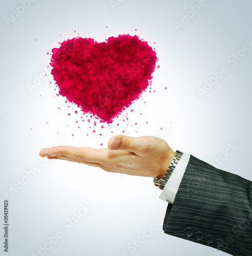 Valentine's day symbol on businessman hend