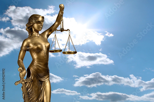 Lady of Justice on sky background