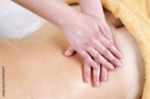 woman receiving back massage © mariangarai