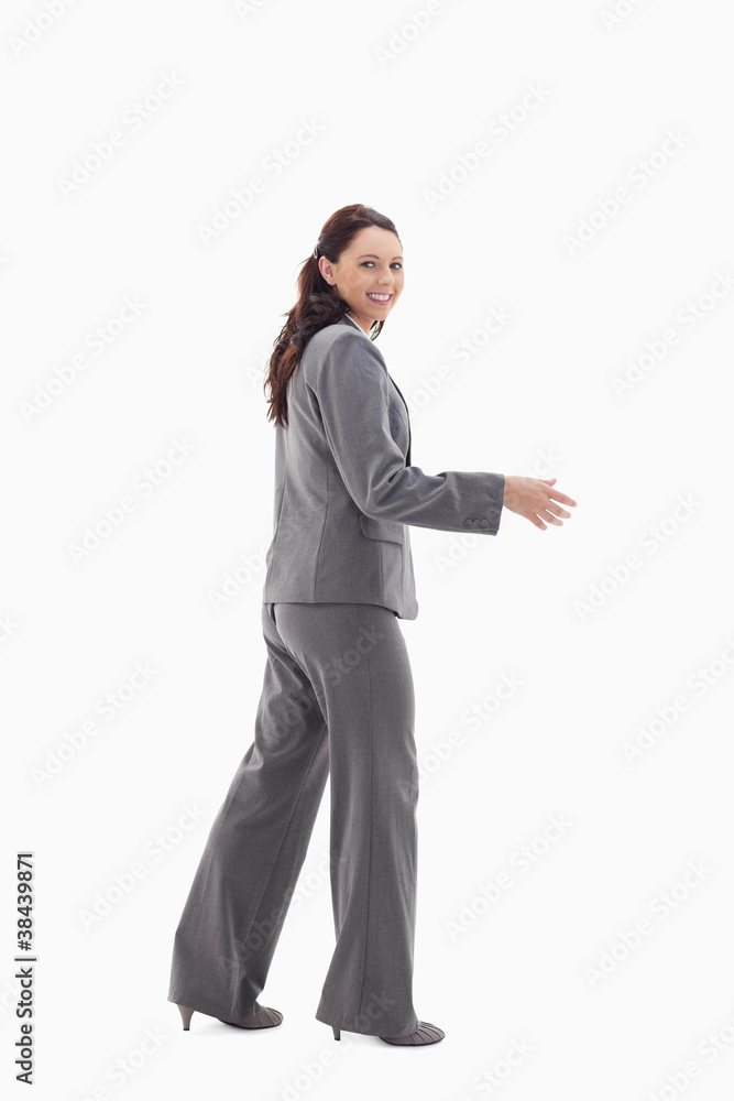 Businesswoman smiling and shaking hands Businesswoman smiling and shaking hands